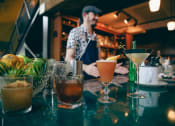 Thumbnail 1 of 14 - Close Up View of Drinks at Bar