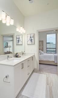 a bathroom with white cabinets and a white toilet at Tapestry West in Richmond, VA 23230