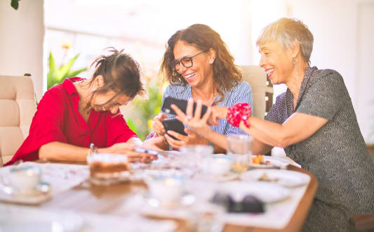 a group of people sitting around a table at a restaurant
