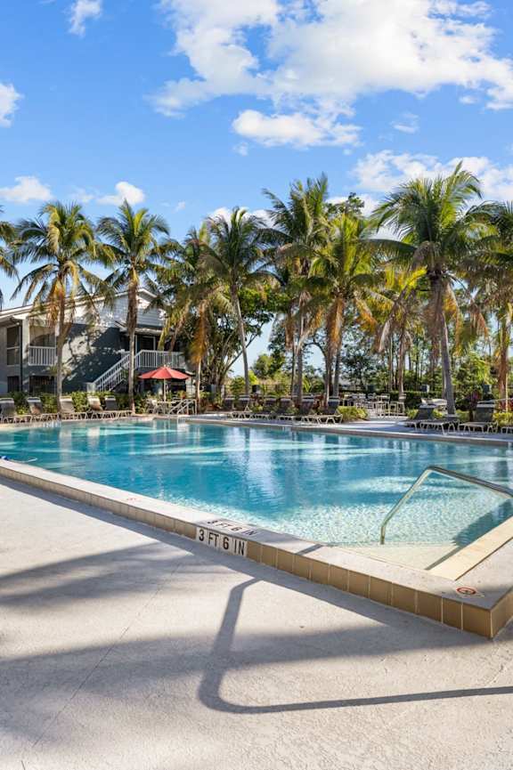 The Park at Positano Apartment Homes Outdoor Pool Area and Lounge Chairs