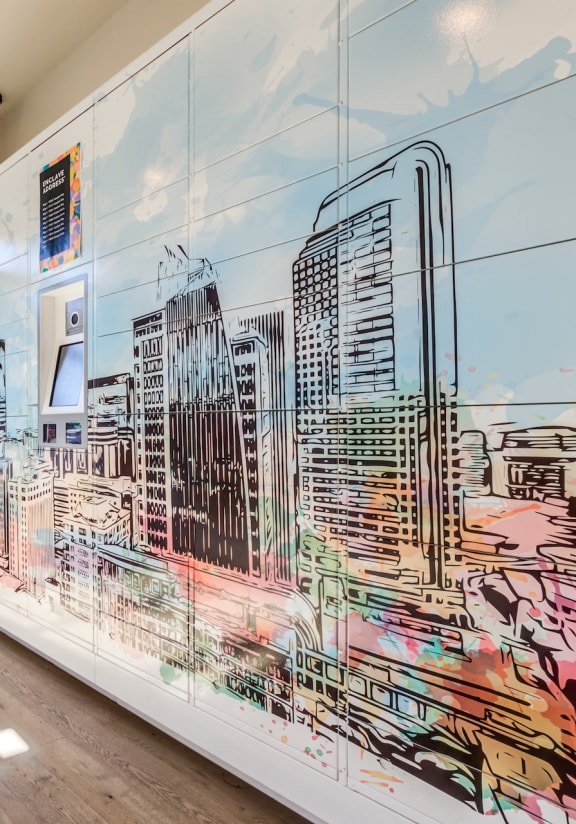 a painting of a city on a wall in a room with a window