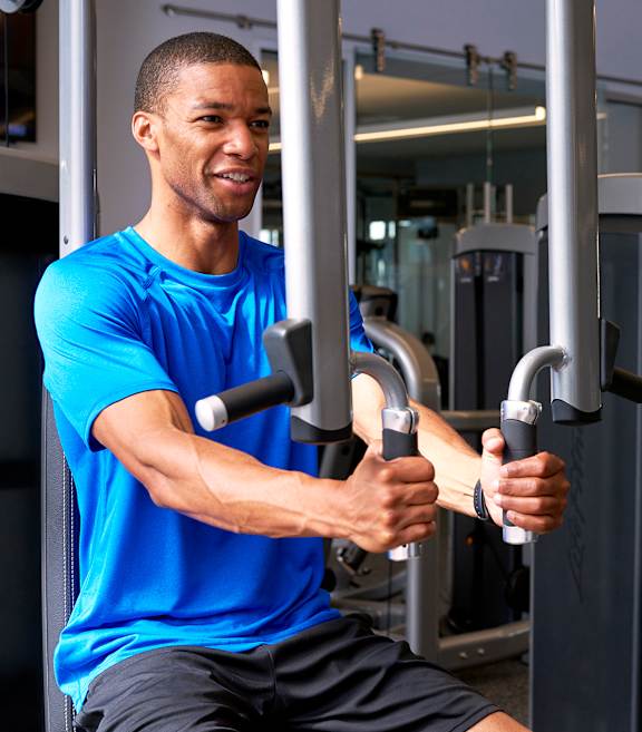 man working out in fitness center at Franklin Residences