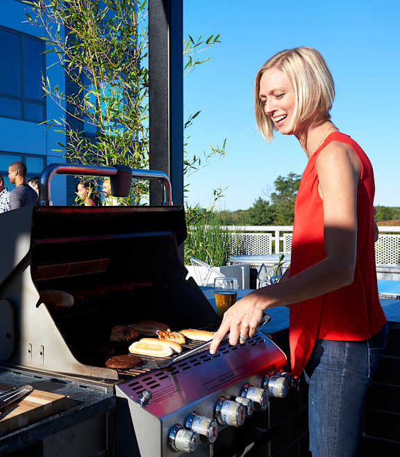 a woman grilling at AVE Florham Park