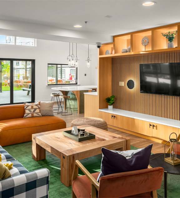 A living room with a television and a couch.
