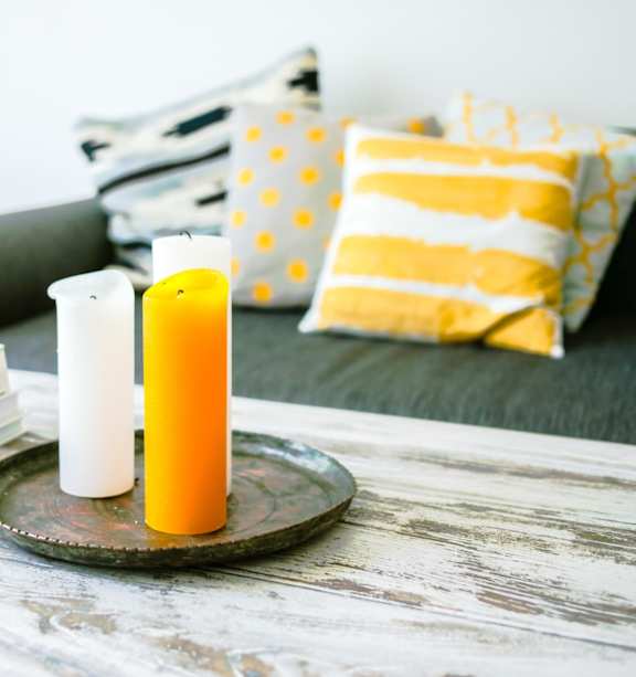 Model Living Room with Sofa and Candles on Coffee Table