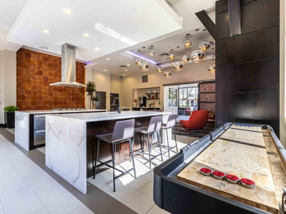 Koi Apartments in Ballard, Washington Clubhouse Lounge and Kitchen with Games at Koi Apartments, Seattle, Washington