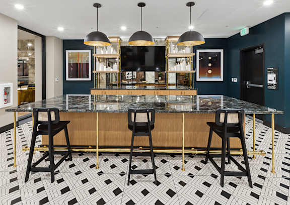 A black and white checkered floor with a bar in the middle.