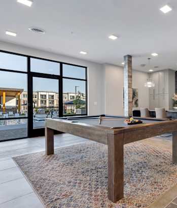 Avenue64 Luxury Apartments in O'Fallon, Missouri Clubhouse Lounge with Kitchen and Pool Table