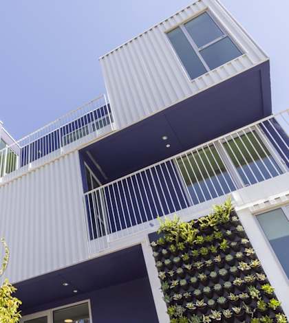 A modern building with balconies and green plants on the walls.at The Wilson, California