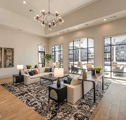 an open living room with couches and a dining room table