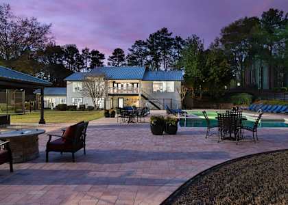 A house with a pool and patio area.