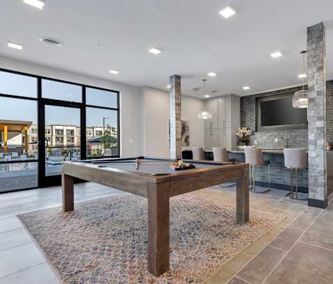 Avenue64 Luxury Apartments in O'Fallon, Missouri Clubhouse Lounge with Kitchen and Pool Table