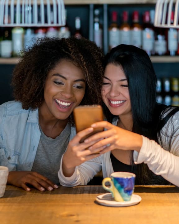 Women looking at phone Stock at Proximity at ODU, Norfolk, Virginia