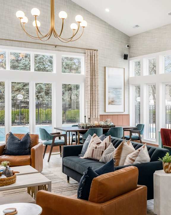 an outdoor kitchen with stainless steel appliances and bar stools