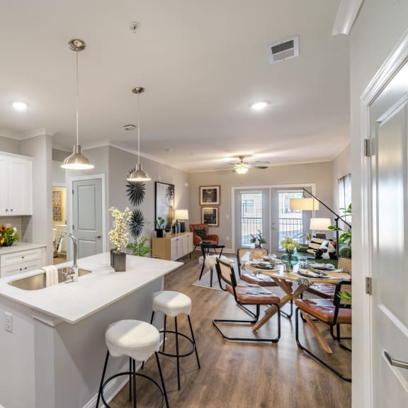 a large kitchen and dining room with a table and chairs