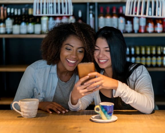 Women looking at phone Stock