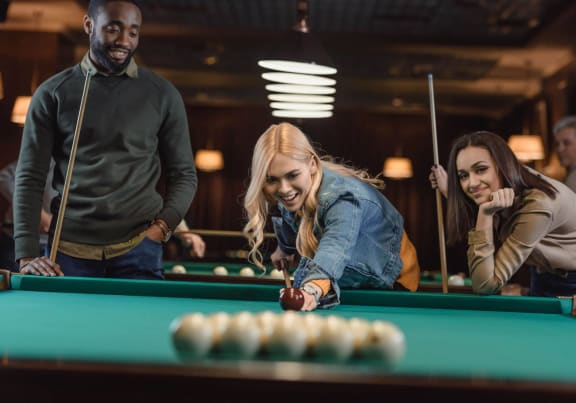 Residents Playing Pool at Sarasota South, Bradenton, FL