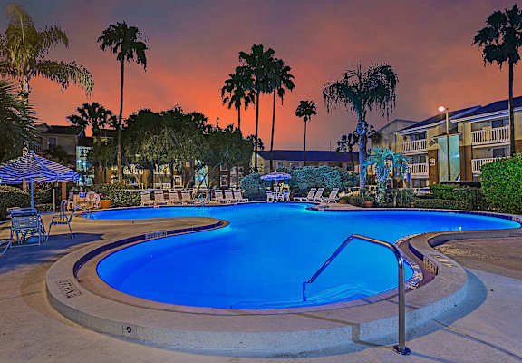 a swimming pool at dusk at the resort at governors crossing