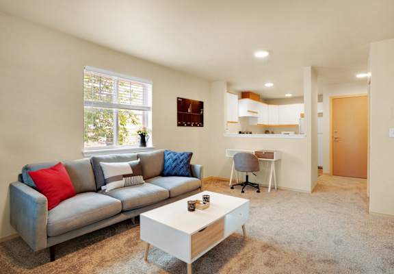 a living room with a couch and a coffee table