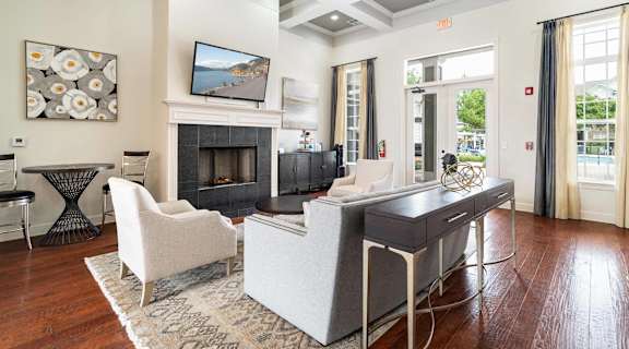 a living room with a couch and a table and a fireplace