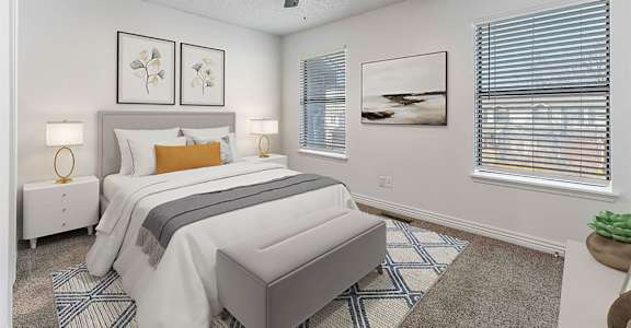 A bedroom with a bed, nightstands, and a ceiling fan.