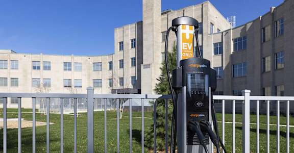 a gas pump in front of a building