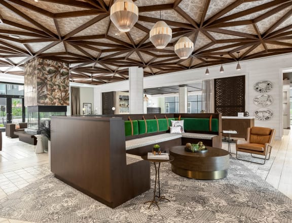 Community lounge with patterned ceiling at Stella Apartments in New Carrollton, MD