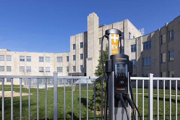 a gas pump in front of a building