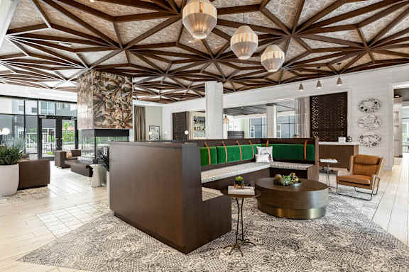 Community lounge with patterned ceiling at Stella Apartments in New Carrollton, MD