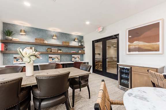 a kitchen and dining room with a table and chairs