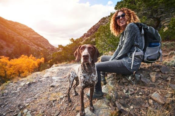 Woman on Hike with Dog