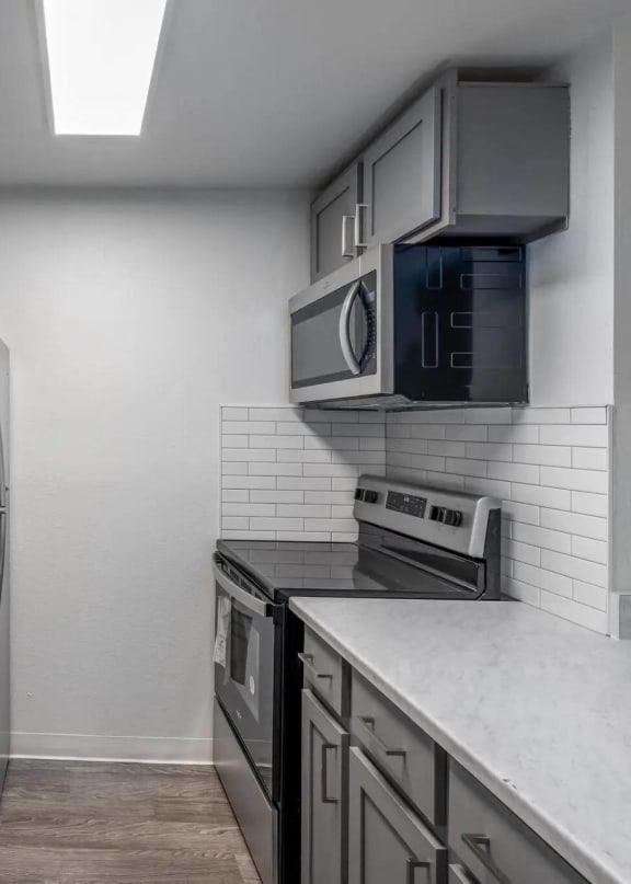 a kitchen with a sink and a refrigerator