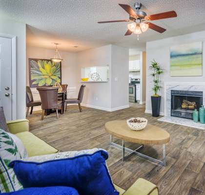 Living Room With Dining Area at The Pointe at Irving Park in Greensboro, NC 27408