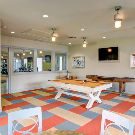 Game Room With Billiards And Shuffleboard at Kingwood Glen, Kingwood, TX, 77339