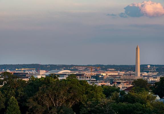 The Washington Monument stands tall in the distance, surrounded by a cityscape.