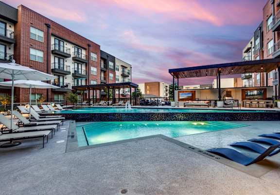 Lenox Cooper Apartments in Arlington, Texas Exterior and Pool with Lounge Chairs