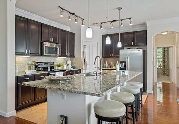 a kitchen with a marble counter topl at Orion McCord Park, Little Elm, 75068