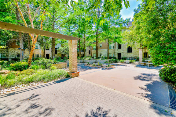 Bentley Place Apartments Courtyard filled with luscious trees and foliage