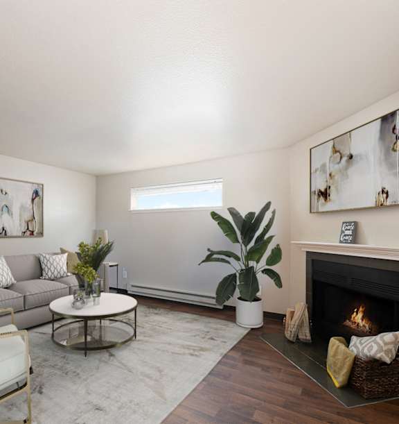A living room with a fireplace and a chair.