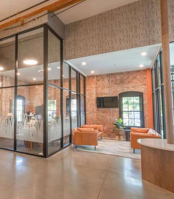 Glass enclosed conference room with modern industrial design at The Overlook Apartments, Weymouth, 02188