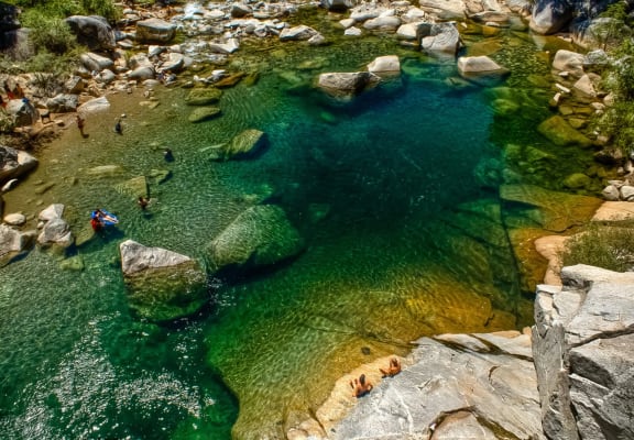 a pool of water with people swimming in it
