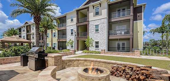 Outdoor Fire Pit with Grill at Cabana Club Apartments in Jacksonville, FL 32256