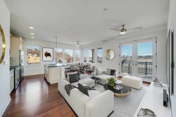 a living room filled with furniture and a large window at Infinity Edgewater, Edgewater, 07020