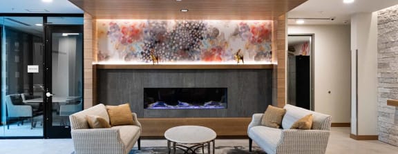 a living room with couches and a fireplace