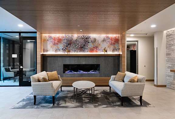 a living room with couches and a fireplace