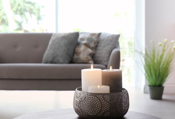 two candles sitting on a table in a living roomat Mill Creek Place, Douglasville, GA 30134