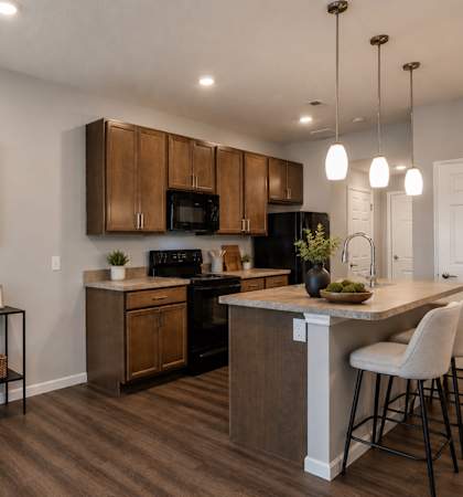 A kitchen with a white countertop and brown cabinets.