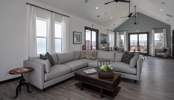 a living room filled with furniture and a large window