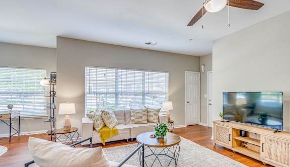 a living room with a couch and a tv
