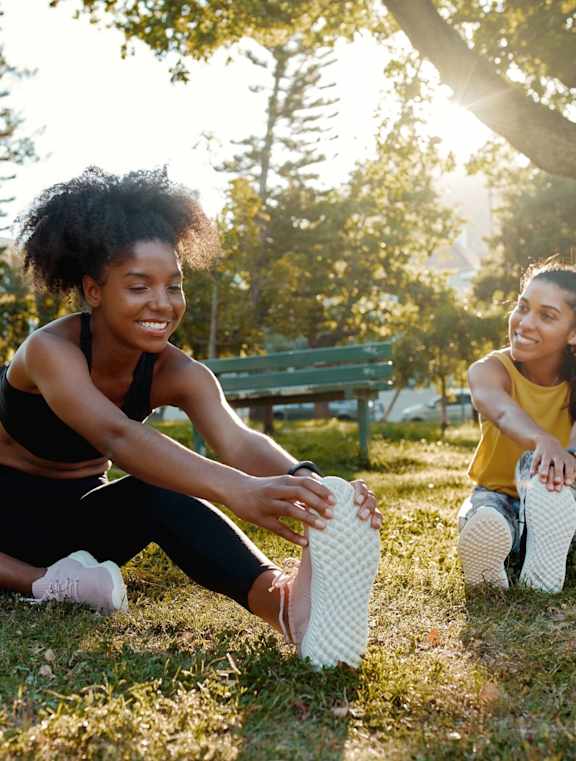 Two Girls Doing Exercise at McKenzie Park Apartments, Arkansas